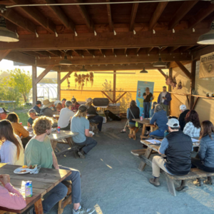 Presentation outside at lunch tables